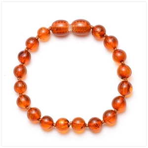Macro detail of natural Baltic amber beaded bracelet with orange-red translucent gems