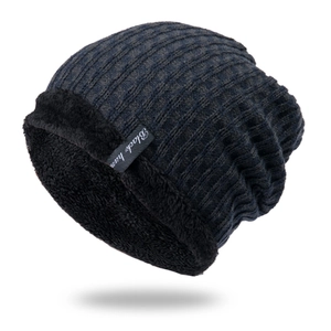 Close-up of knit beanie with navy mixed texture and thick black fleece lining