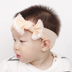 Soft nylon baby headband with apricot lace-edged bow for infants and toddlers