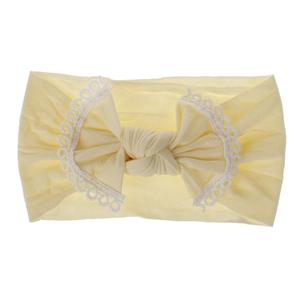 Ultra-soft nylon baby headband featuring a beautiful lace-trimmed bow in pale yellow color