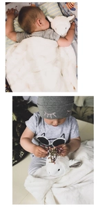 Close-up of white plush sheep comforter blanket for baby sleep soothing comfort