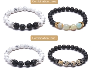 Detail of beaded bracelets with white turquoise, lava stone and zircon crown charms