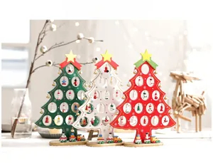 Detailed view of red, white, and green mini wooden DIY Christmas trees with ornaments