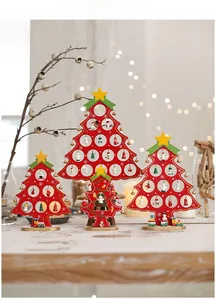 Detailed view of four red wooden Christmas tree ornaments with stars on a warm desk