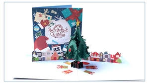 Detail of 3D pop-up Christmas tree card with colorful gift boxes and snowy night scene