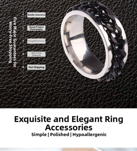 Detail of silver stainless steel ring with rotatable black cuban chain inlay