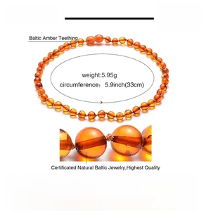 Detailed spec sheet for Baltic amber teething necklace showing size 33cm and weight 5.95g