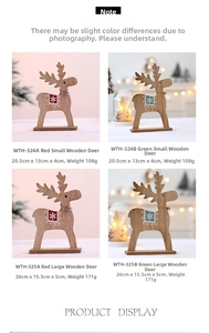 Detailansicht von Weihnachtsrentier-Holzfiguren mit Schneeflockenmuster und kleinen Glocken