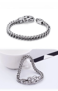 Detailed view of men's stainless steel keel chain bracelet with unique knot clasp