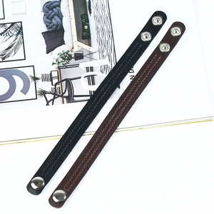 Minimalist punk style leather bracelets in black and brown with silver metal buckles