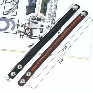 Minimalist leather bracelets with heart embroidery and snap buttons in black and brown
