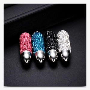 Detail of bullet-shaped pendant necklaces with pink, blue, black and white crystals