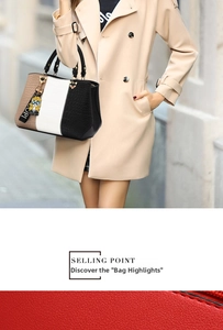Detail of crocodile texture PU leather handbag with tricolor patchwork and doll pendant