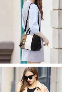 Detailed view of tricolor faux leather bag with crocodile texture and girl charm