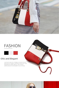 Detail of tricolor crocodile pattern leather tote with heart metal charm and strap