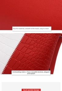 Detail of red and white faux crocodile texture and back pocket on large PU leather tote bag