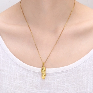 18K gold plated stainless steel peanut pendant necklace shown on a female model