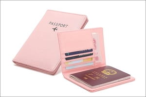 Pink PU leather RFID passport holder with multiple slots for cards and travel documents
