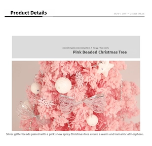 Detail of pink flocked mini Christmas tree with silver bead chain and white ornaments