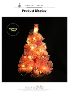 Pink mini Christmas tree detail with warm LED lights, starfish, and pearl chain decor