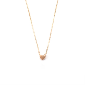 Elegant gold minimalist necklace featuring a small solid heart pendant on a fine chain
