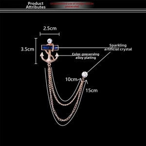 Detailed size chart of a nautical anchor brooch with navy blue crystals and tassels