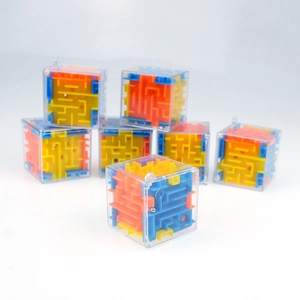 Close-up of 3D maze cubes with transparent shells and colorful internal tracks for kids