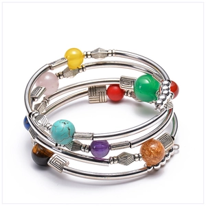 Detailed top view of bohemian multilayer wrap bracelet with colorful beads and silver spacers