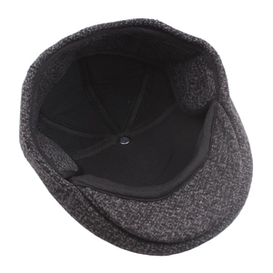 Winter checkered knit ivy cap with warm ear flaps and thick padded lining in dark grey