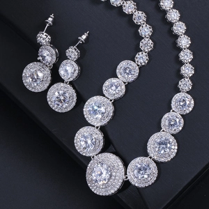 Macro detail of silver bridal jewelry set featuring micro-pave cubic zirconia crystals