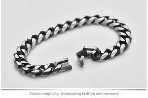 Detail showing the mechanical clasp and brushed metal texture of the Cuban link bracelet