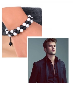 Detail of double-layer beaded bracelet featuring matte black and white marble stones