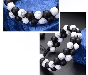 Macro detail of double-layer braided bracelet with matte black and white turquoise beads