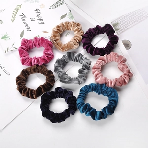 Set of 8 colorful velvet scrunchies in various shades with a soft premium texture