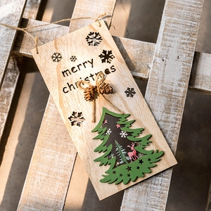 Wooden Merry Christmas hanging sign with pine cones and green tree decoration