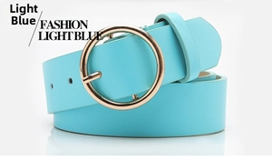 Detail of light blue leather belt with a circular golden metal buckle for casual wear