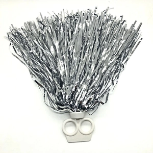 Macro detail of silver metallic pom pom with dual-ring handle for cheerleading