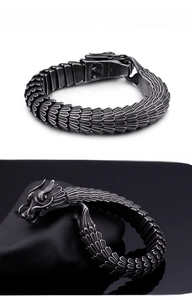 Detailed view of vintage dragon scale texture and carved head on 316L stainless steel bracelet
