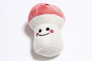 Detail of a plush mushroom toy with pink cap and embroidered smiling face for dogs