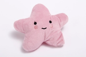 Close-up of pink star plush dog toy featuring embroidered smiley face and soft texture