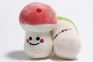 Close-up of mushroom plush dog toys with soft fabric and embroidered facial details