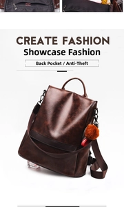 Detail view of brown PU leather backpack with back anti-theft opening and plush charm