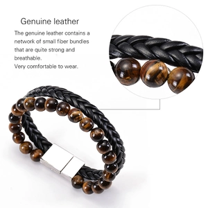 Close-up of double-layer men's leather bracelet with tiger eye beads and magnetic clasp