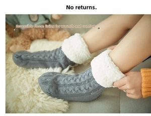 Detailed view of thick knit thermal floor socks with white fleece lining in grey