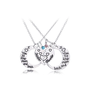Detailed view of silver mother and daughter moon heart necklaces with colored crystals