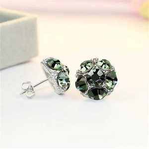 Detailed close-up of dark green crystal ball stud earrings with silver metal backing
