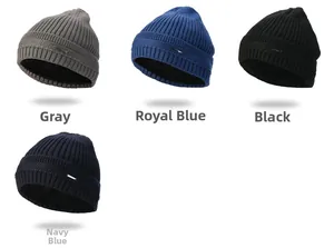 Detail of multi-color ribbed knit beanies with warm fleece lining and metal logo