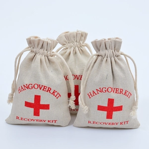 Three beige cotton drawstring pouches featuring red Hangover Kit and Recovery Kit text