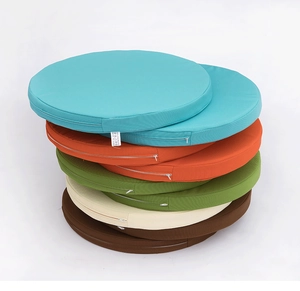 Macro detail of various colorful round waterproof outdoor cushions with invisible zipper