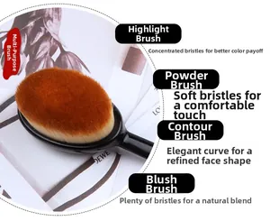 Detail of toothbrush-style foundation brush with dense brown fibers and black ergonomic handle